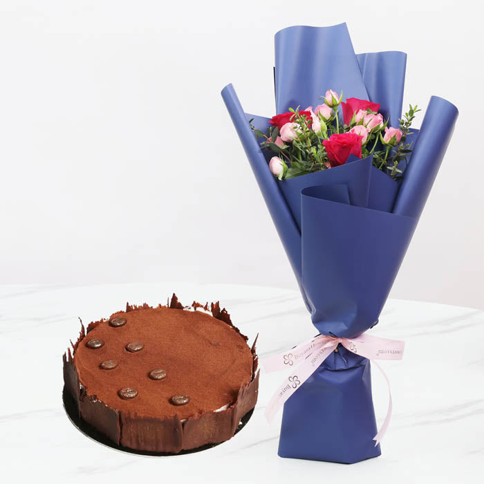 Blush WhimsyChocolate & Confectionery3 Dark Pink Roses 2 Stems of Pink Baby Roses 1 Stem of Parvifolia Elegantly wrapped in violet-colored paper and tied with a soft pink ribbon. 4 Portion Tiramisu Cake
