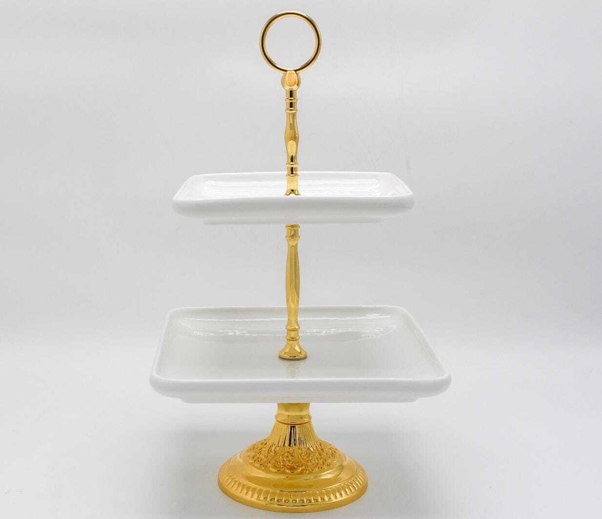 Pilsimo Elegant 2-Tier Gold-Plated Serving Stand with Ceramic Plates - Perfect for Desserts & SnacksKitchen StorageElevate your hosting game with the Pilsimo Elegant 2-Tier Serving Stand. With a luxurious gold-plated design and two ceramic plates, it's pe