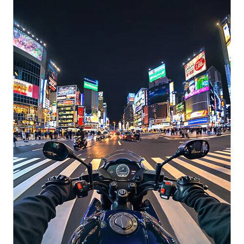 Motorcycle on a city street at night with bright neon signs and lights taken with Insta360 Ace Pro 2 8K AI-Powered Action Camera