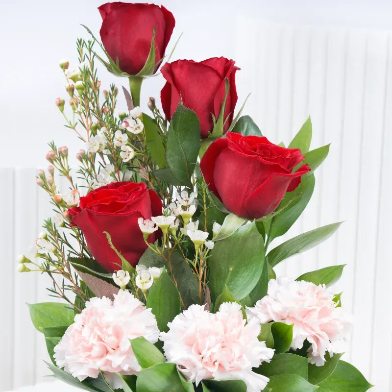 Memories 7 roses and carnation flower arrangement