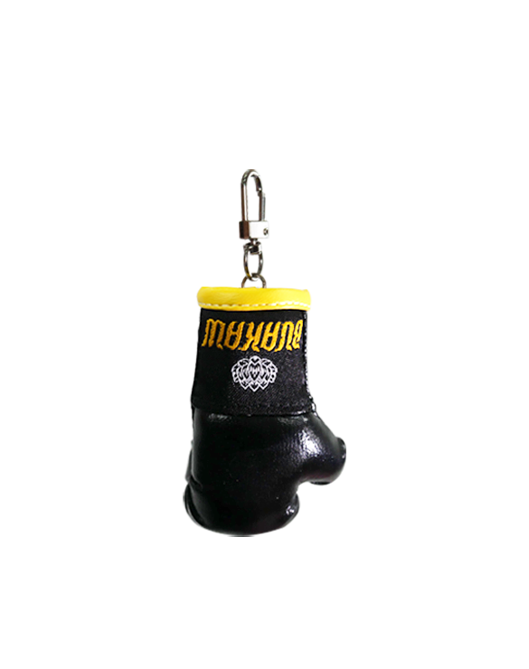 Buakaw Boxing Glove KeychainSports ClothingMade from high-quality PU leather and featuring a classic lobster hook, this stylish accessory comes adorned with the Buakaw brand label in striking gold and black colors. It makes a perfect Muay Thai souvenir fr