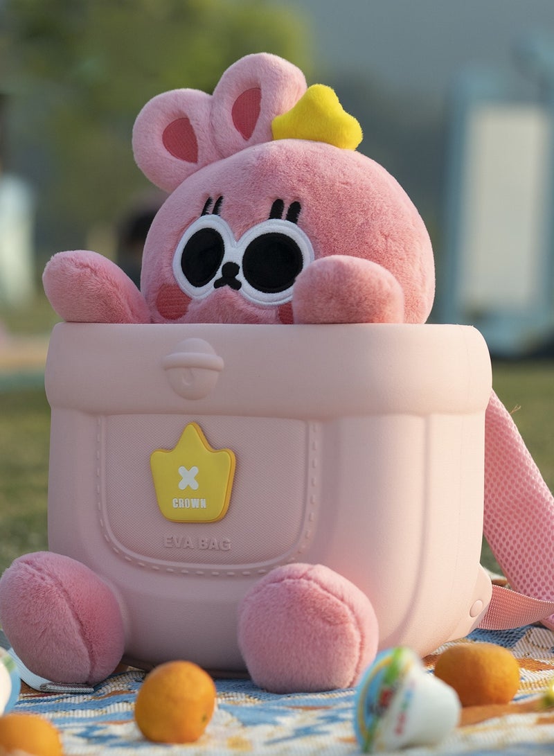 Pink plush toy with a yellow star on a blanket outdoors