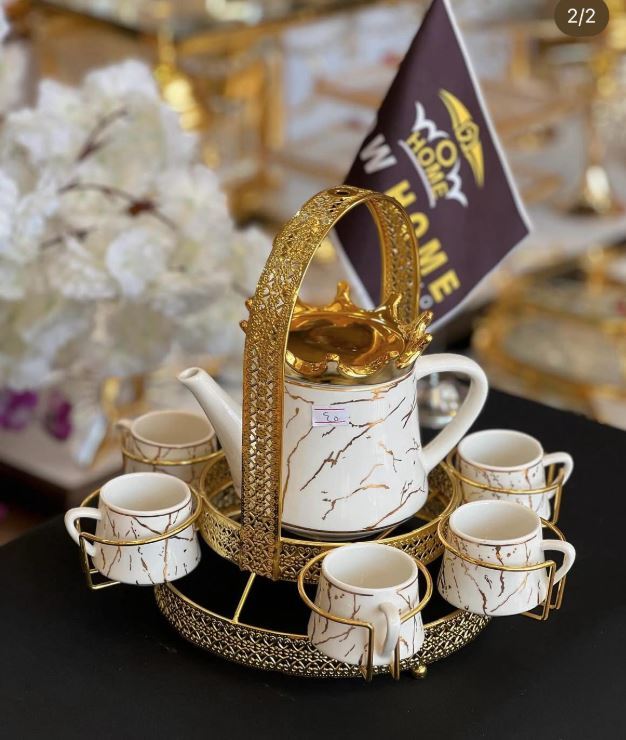 Luxury Marble Design Tea & Coffee Set | Elegant Ceramic Jug with Gold Metal Stand & CupsKitchen StorageElevate your coffee or tea time with the Luxury Marble Design Tea & Coffee Set. This elegant set features a stunning marble design ceramic jug and gold