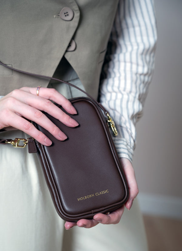 Holborn Classic Luna Leather Phone Pouch Zipped BrownHandbags & WalletsKeep your phone stylish and secure with our Luna Leather Phone Pouch. Made from high quality brown leather, this zipped phone pouch is a must-have for women on the go. Safely store you