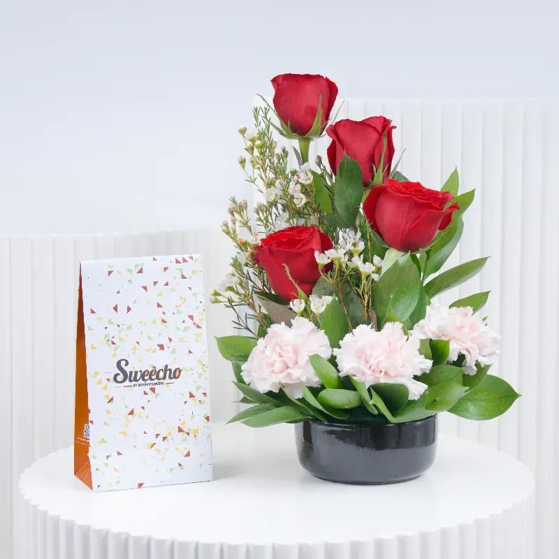 Memories 7 roses and carnation arrangement with chocolate