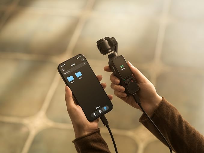 DJI Osmo Pocket 4 compact size held in hand showing pocket form factor