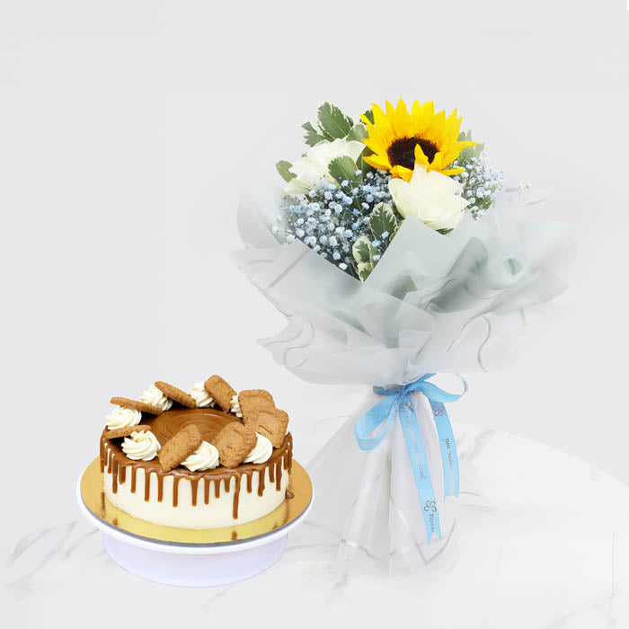 Blue Serenity DelightChocolate & Confectionery1 Bright Yellow Sunflower 3 Elegant White Roses 2 Stems of Soft Blue Baby’s Breath (Gypsophila) Fresh Greenery for a Natural Touch Beautifully wrapped in translucent white paper and tied with a soft blue satin