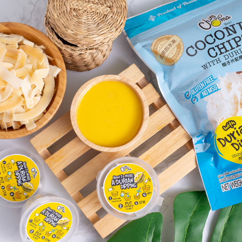 CHIMMA Coconut Chips with Durian Dip 65GSnacksA delightful snack made from crispy coconut chips, paired with a bold and aromatic durian dip. The light crunch of coconut chips contrasts beautifully with the creamy texture and deep flavor of the durian dip,