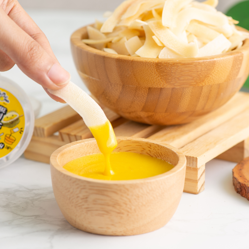 CHIMMA Coconut Chips with Durian Dip 65GSnacksA delightful snack made from crispy coconut chips, paired with a bold and aromatic durian dip. The light crunch of coconut chips contrasts beautifully with the creamy texture and deep flavor of the durian dip,