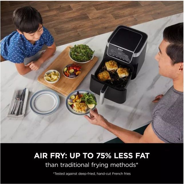 Ninja AF180ME 2000W air fryer in modern kitchen setting