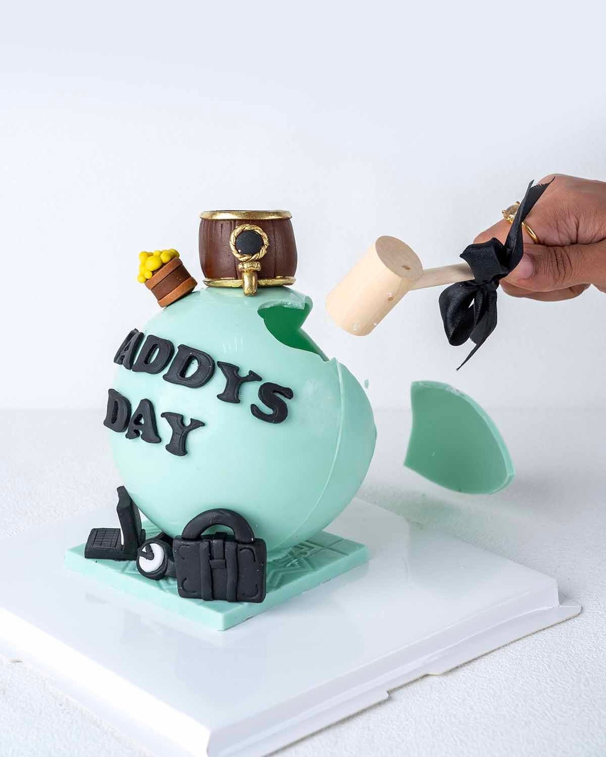 Fathers Day theme Smash BallChocolate & ConfectioneryYour Gift Contains: • 560gms Daddys Day Smash Ball • 10 x Milk Chocolate Truffles • Flavors: Pistachio, Hazelnut, Speculoos, Peanut Butter, Caramel and Roche • Hammer x 1 • Chocolate Size:12x12x20cm • B