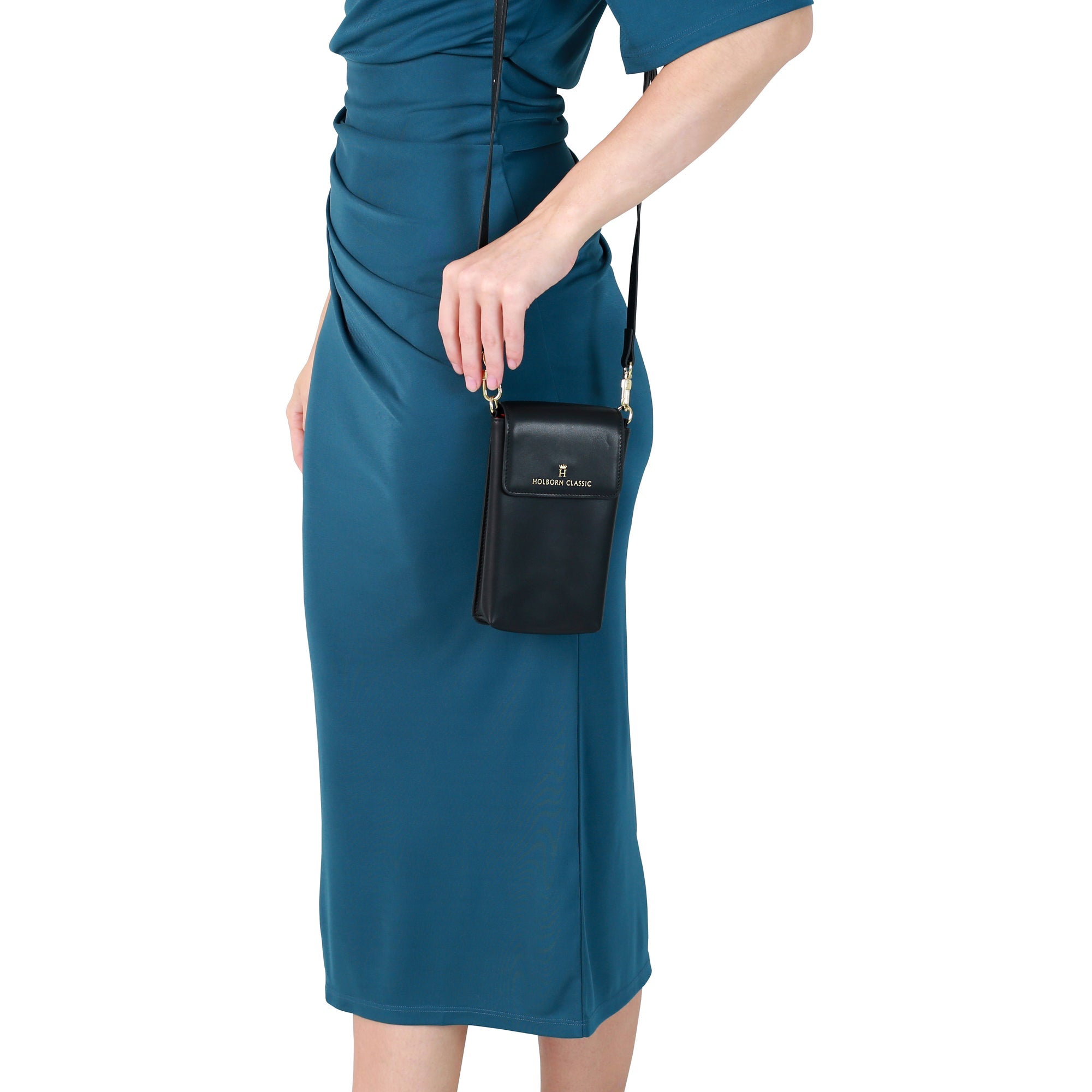 Holborn Classic Anna Leather Phone Pouch Flapped BlackHandbags & WalletsElevate your style with the Anna Leather Phone Pouch Flapped. Crafted from luxurious leather, this black phone pouch is perfect for busy women on-the-go. Keep your phone safe and secu