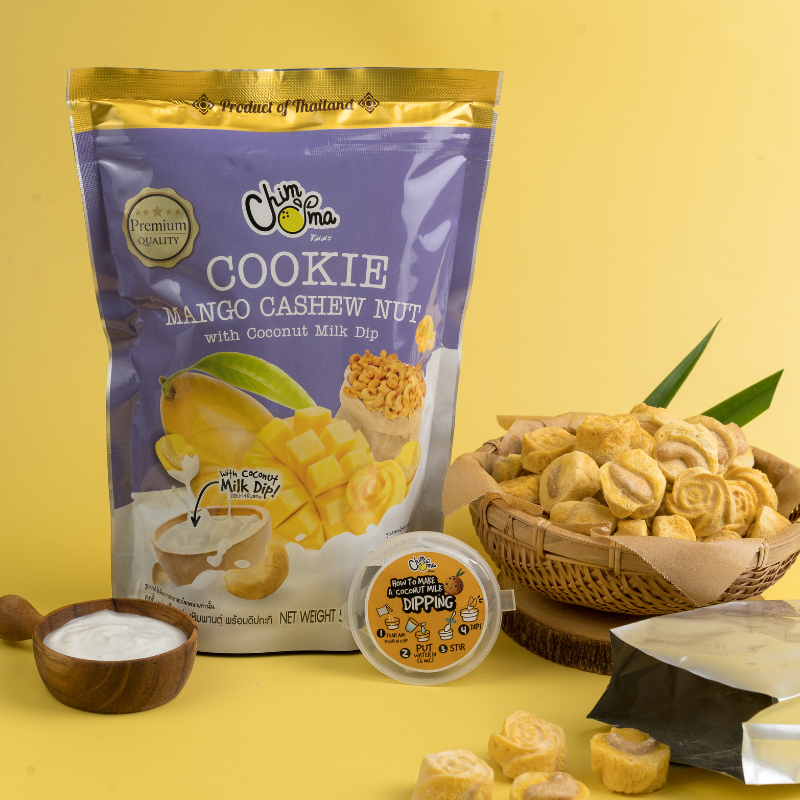 CHIMMA Cookies Mango Cashew Nut with Coconut Milk Dip 50GSnacksA delicious fusion of Thai flavors in a crunchy cookie! These handcrafted mango-infused cashew nut cookies offer a buttery, nutty crunch with a hint of tropical fruitiness. When dipped into th