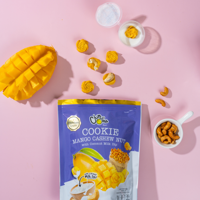 CHIMMA Cookies Mango Cashew Nut with Coconut Milk Dip 50GSnacksA delicious fusion of Thai flavors in a crunchy cookie! These handcrafted mango-infused cashew nut cookies offer a buttery, nutty crunch with a hint of tropical fruitiness. When dipped into th