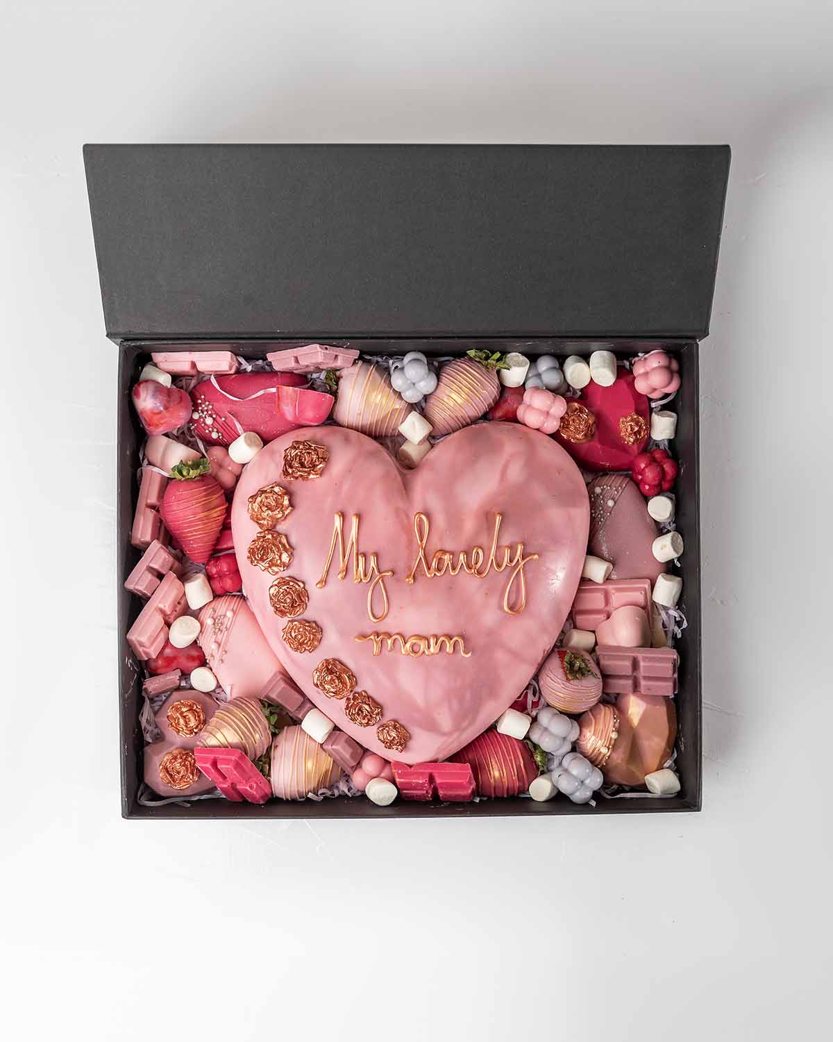 Mother's Day Special Sweet Box by NJDChocolate & ConfectioneryYour Gift Contains:• 6x Mini Hearts (16 grams each)• 6 x Chocolate Covered Strawberries• 3 x Cakesicles • 3 x Chunky heart (50grams each)• 5 Milk Chocolate Truffles• 14pcs Mini Ombre Chocolates
