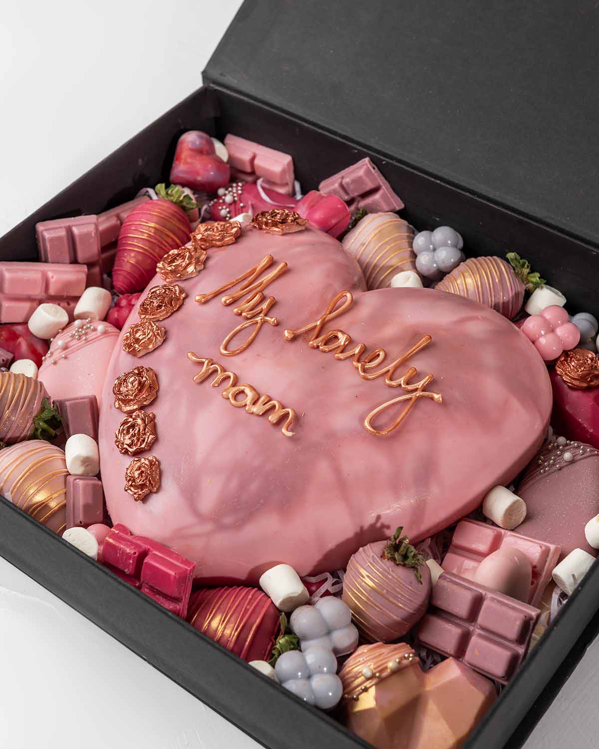 Mother's Day Special Sweet Box by NJDChocolate & ConfectioneryYour Gift Contains:• 6x Mini Hearts (16 grams each)• 6 x Chocolate Covered Strawberries• 3 x Cakesicles • 3 x Chunky heart (50grams each)• 5 Milk Chocolate Truffles• 14pcs Mini Ombre Chocolates