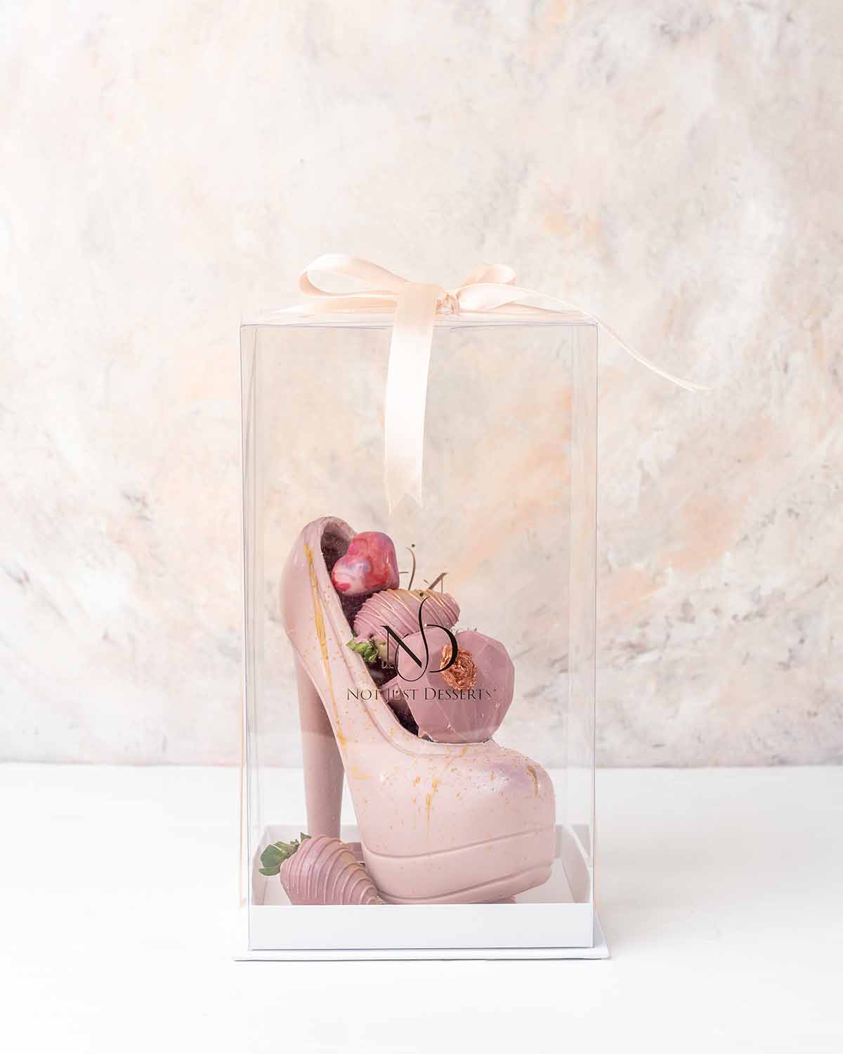 Chocolate Stiletto with Chocolate Berries by NJDChocolate & ConfectioneryYour Gift Contains:• Edible Heels• 2 x Mini and chunky heart• 5 x chocolate covered strawberries and mini chocolate bars• Chocolate Weight: Approx. 540grams• Chocolate Size: 11x11x18