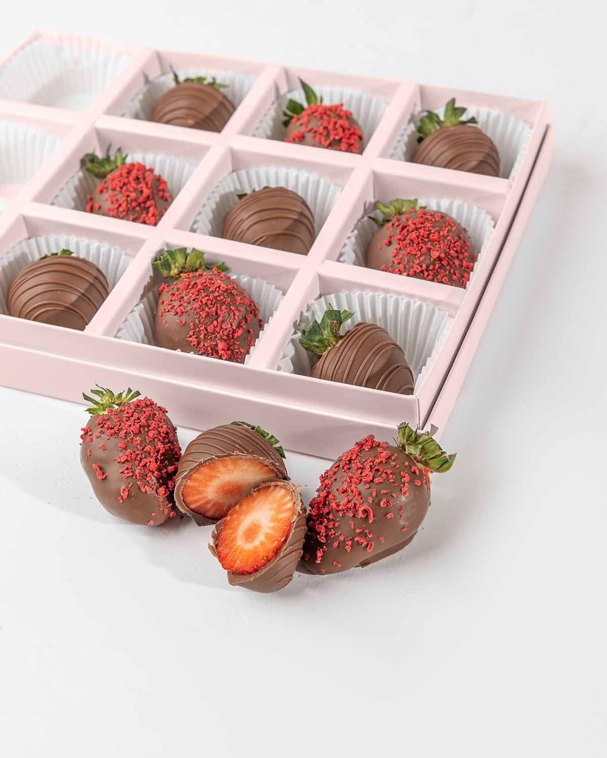 Milk Chocolate Strawberries '24 Collection by NJDChocolate & ConfectioneryYour Gift Contains:• 12 x Chocolate covered strawberries• Box Size: 24x18x4cmHandling and Storage • Keep away from direct heat and sunlight• Best stored between 12-18 °C• Strawberri