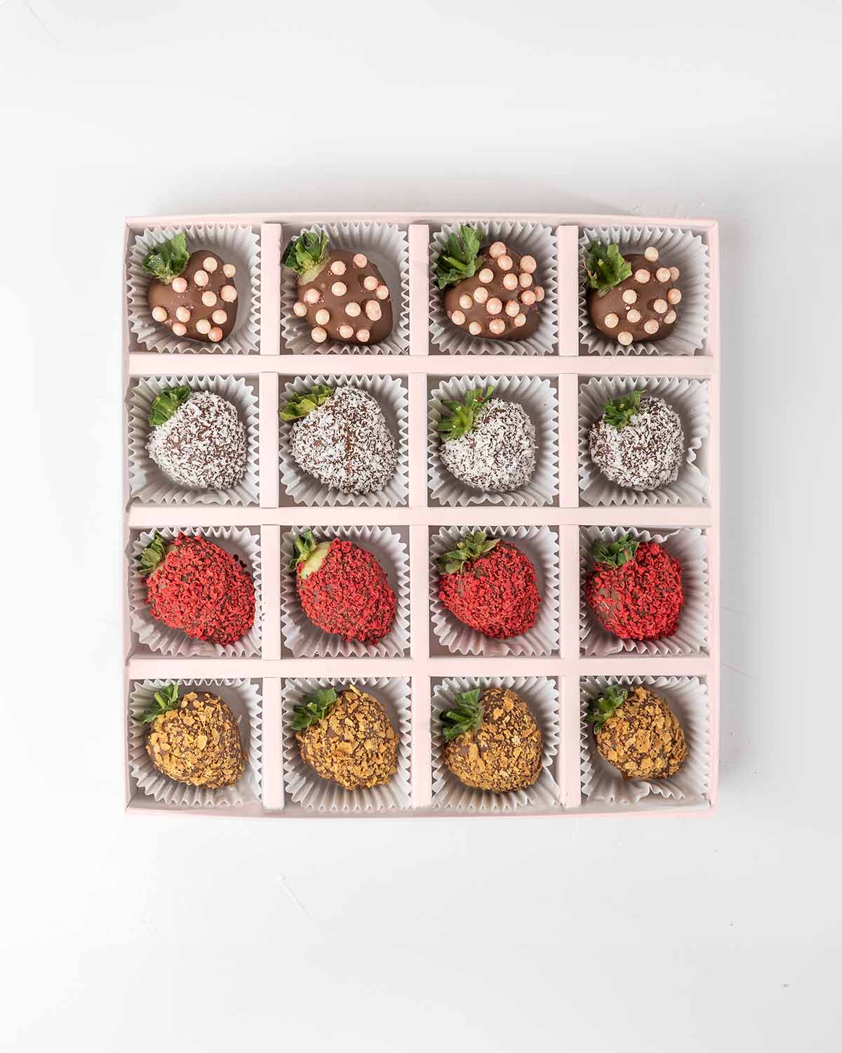 16 Chocolate Strawberries '24 Collection by NJDChocolate & ConfectioneryYour Gift Contains:• 16 x Chocolate covered strawberries• Box Size: 24x24x4cmHandling and Storage • Keep away from direct heat and sunlight• Best stored between 12-18 °C• Strawberries