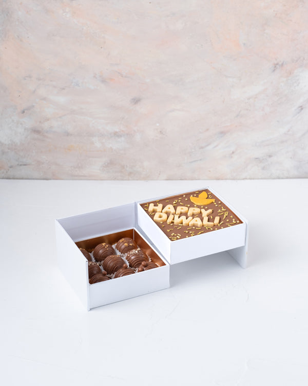 Happy Diwali Bar and TrufflesChocolate & ConfectioneryYour Gift Contains: • 1 Happy Diwali Milk chocolate bar • 9 assorted Milk chocolate Truffles • Weigh of chocolate: 270grams • Flavors: Pistachio, Hazelnut, Speculoos, Peanut Butter and Roche • Size of