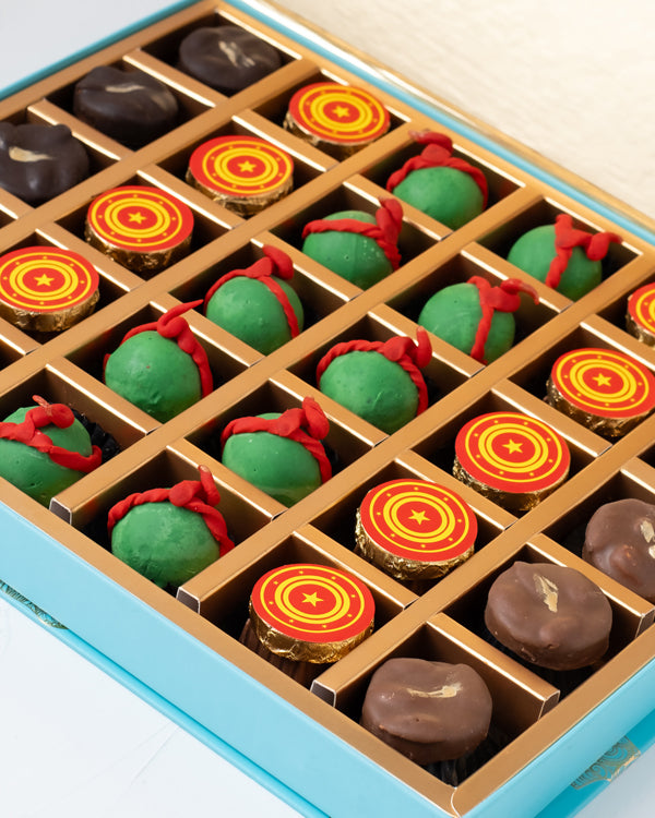 Cake Pops, Chocolates adChocolate & ConfectioneryYour Gift Contains: • 10 Chocolate cake pops • Cake pops flavor: Chocolate / Vanilla / Red Velvet • 10 Milk chocolate coins • 5 assorted Dark chocolates • 5 assorted Milk chocolates • Weigh of chocolate: 57