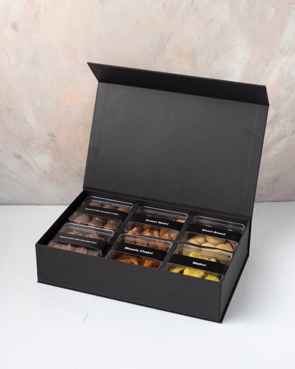Premium Sweet and Savory Gift Box by NJDChocolate & ConfectioneryYour Gift Contains: • Approx. 200grams of Shankarpali • Approx. 200grams of Cookies • Approx. 170grams of Methi Matthi • Approx. 100grams of Murukkum Sweet • Approx. 250grams Chocolates with