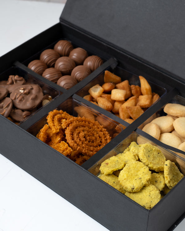 Premium Sweet and Savory Gift Box by NJDChocolate & ConfectioneryYour Gift Contains: • Approx. 200grams of Shankarpali • Approx. 200grams of Cookies • Approx. 170grams of Methi Matthi • Approx. 100grams of Murukkum Sweet • Approx. 250grams Chocolates with