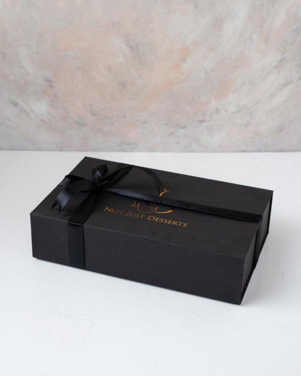 Premium Sweet and Savory Gift Box by NJDChocolate & ConfectioneryYour Gift Contains: • Approx. 200grams of Shankarpali • Approx. 200grams of Cookies • Approx. 170grams of Methi Matthi • Approx. 100grams of Murukkum Sweet • Approx. 250grams Chocolates with