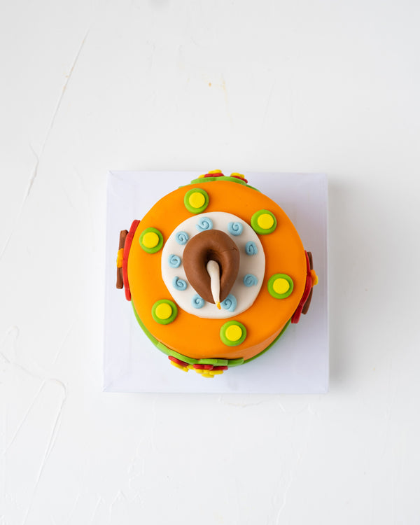 Ethnic Diwali Mini CakeChocolate & ConfectioneryYour Gift Contains: • 1KG Diwali Theme Cake • Flavor: Chocolate/Vanilla/Red Velvet • Box Size: 16.5x16.5x20cm Handling and Storage • Keep away from direct heat and sunlight • Best stored between 12-18 °C • N