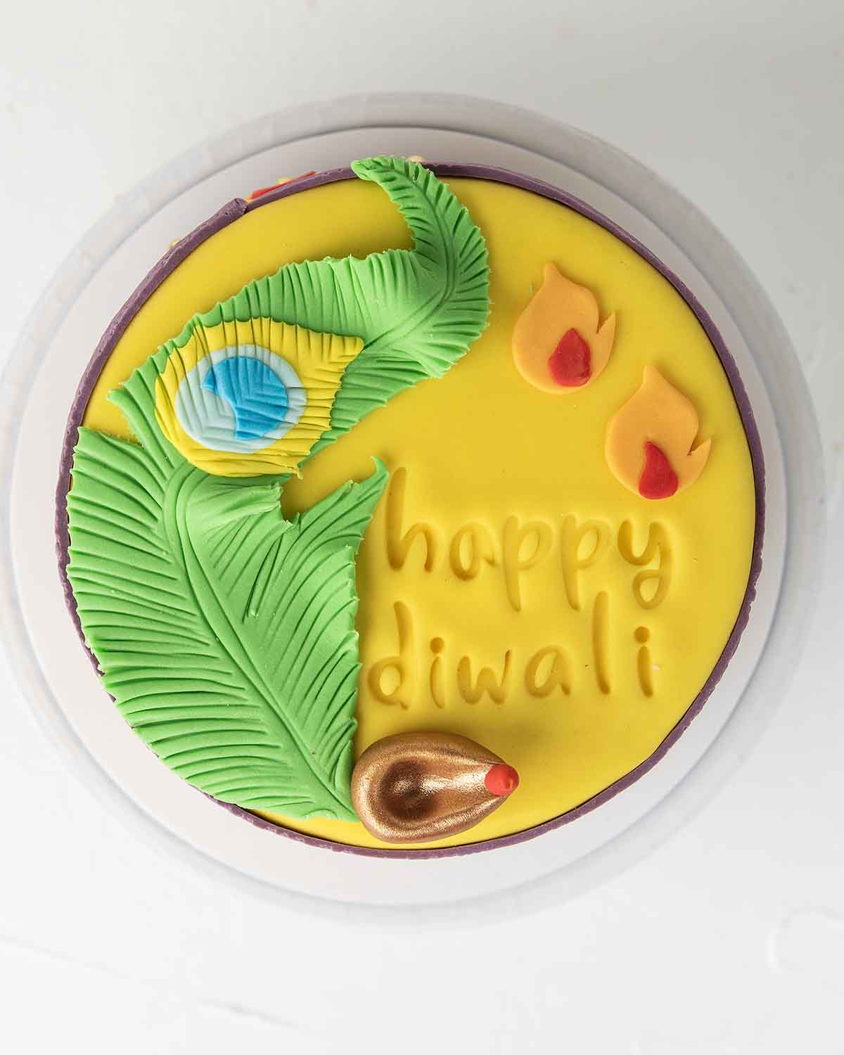 Diwali Ethnic CakeChocolate & ConfectioneryYour Gift Contains:• 1kg Diwali Theme Cake• Flavor: Chocolate/ Vanilla/ Red Velvet/ Brownie• Box Size: 21x21x25cmHandling and Storage • Keep away from direct heat and sunlight• Best stored between 12-18 °C• Suita