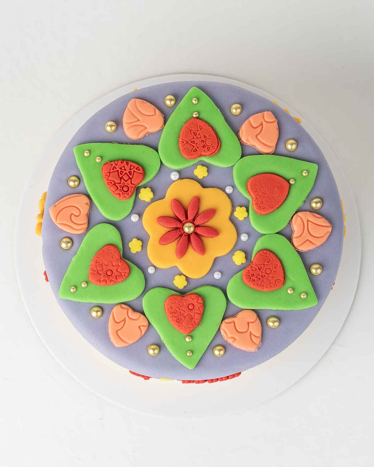 Diwali Swastik CakeChocolate & ConfectioneryYour Gift Contains:• 1kg Diwali Theme Cake• Flavor: Chocolate/ Vanilla/ Red Velvet/ Brownie• Box Size: 21x21x25cmHandling and Storage • Keep away from direct heat and sunlight• Best stored between 12-18 °C• Suit