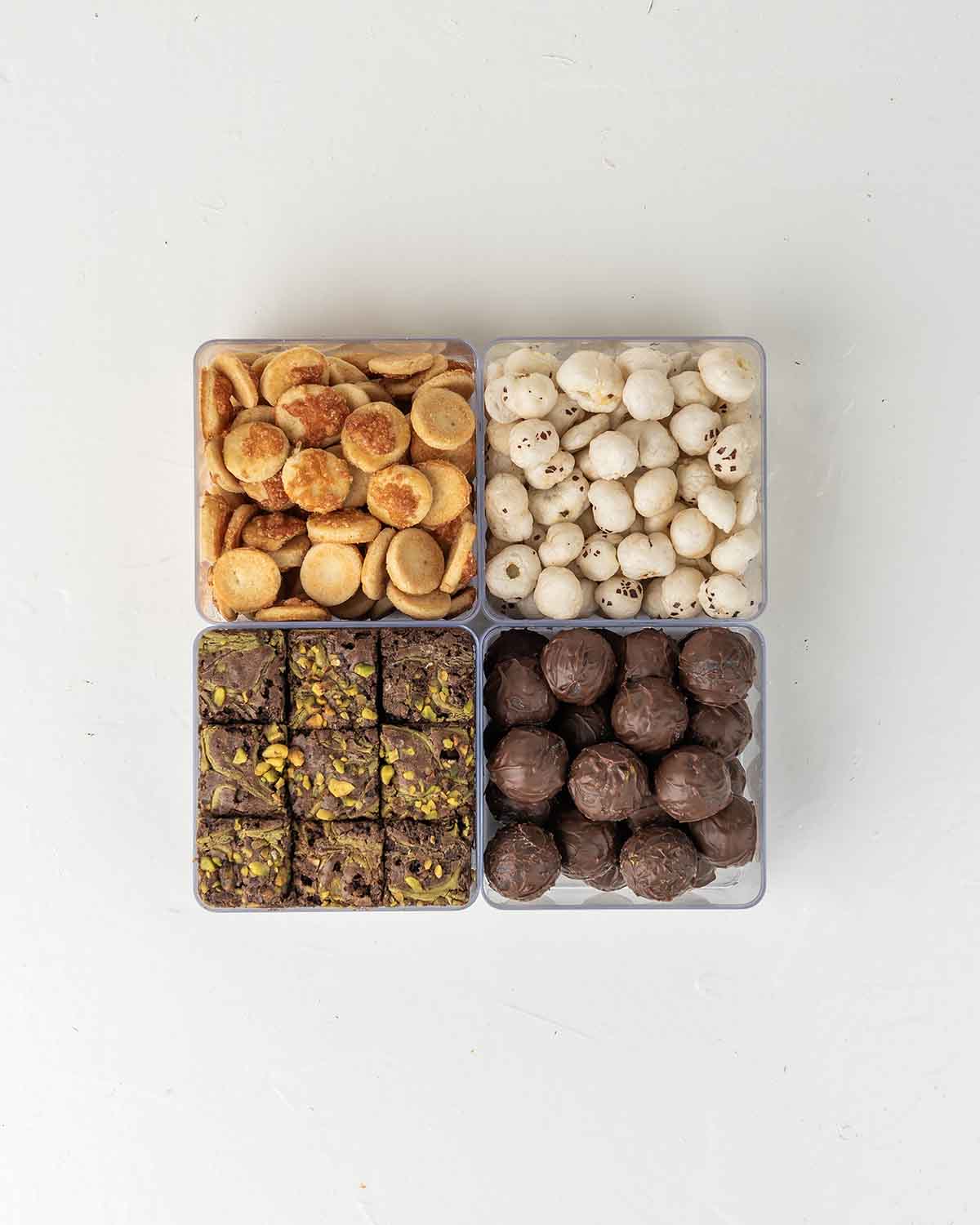 Diwali Assortment with Savory and SweetsChocolate & ConfectioneryYour Gift Contains:• 150gm Savory Chilly Biscuit• 350gm Brownie Bites • 30gm Savory Fox Nut• 300gm Milk Chocolate Truffles filled in Pistachio, Hazelnut, Speculoos, Peanut Butter and Roche•
