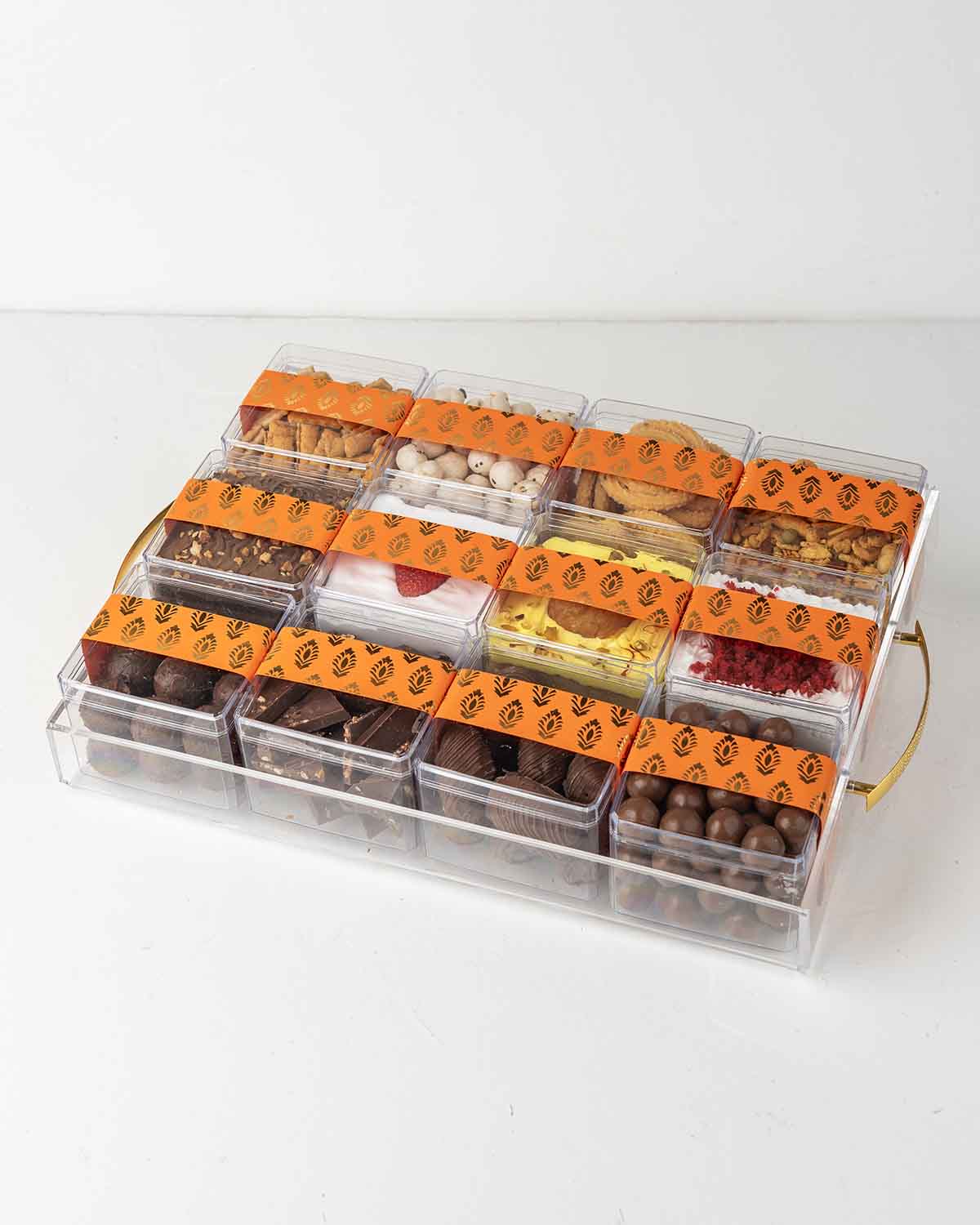 Multiple Assortment Diwali Gift TrayChocolate & ConfectioneryYour Gift Contains:• 200gm Chirwa Flakes• 30gm Savory Fox Nuts• 150g Murukku • 120g Savory Chilly Biscuit• 300gms Brownie Cake• 200gms Vanilla Cake with Strawberry• 200gms Gulab Jamun flavor cak