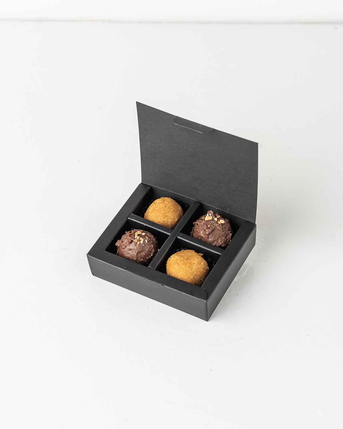 Mini Diwali TreatChocolate & ConfectioneryYour Gift Contains:• 2 x Besan Laddu• 2 x Milk Chocolate Truffles • Box Size: 10x8x2.5cmHandling and Storage • Keep away from direct heat and sunlight• Best stored between 12-18 °C• Suitable for vegetarians • Not