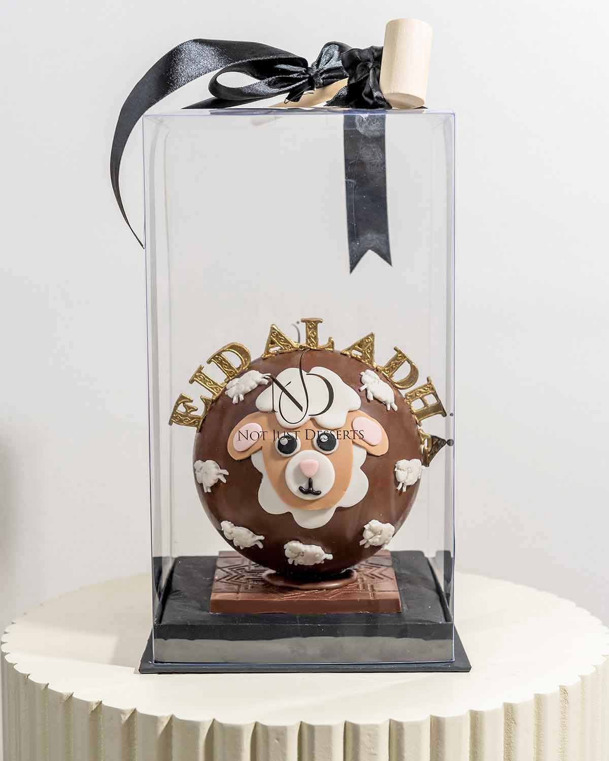 EID Al ADHA Hand Designed SMASH BallChocolate & ConfectioneryYour Gift Contains:• Approx 420g Eid al Adha Smash Ball• 10pcs Milk Chocolate Assorted Truffles • Flavors: Pistachio, Hazelnut, Speculoos, Peanut Butter and Roche • Chocolate size: 12x12x15cm •