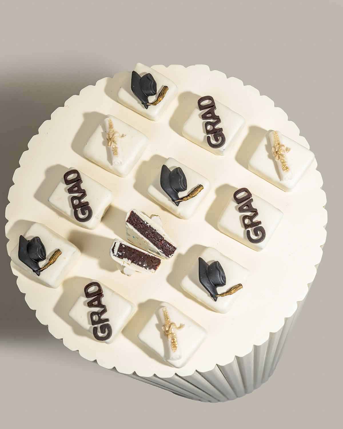 Graduation Cake bites 2024 by NJDChocolate & ConfectioneryYour Gift Contains:• 12 x Chunky Cake bites• Cake Flavors: Chocolate/Vanilla/Red Velvet• Chocolate Weight: 900gm approx.• Box Size: 24x18x4cmHandling and Storage • Keep away from direct heat and su