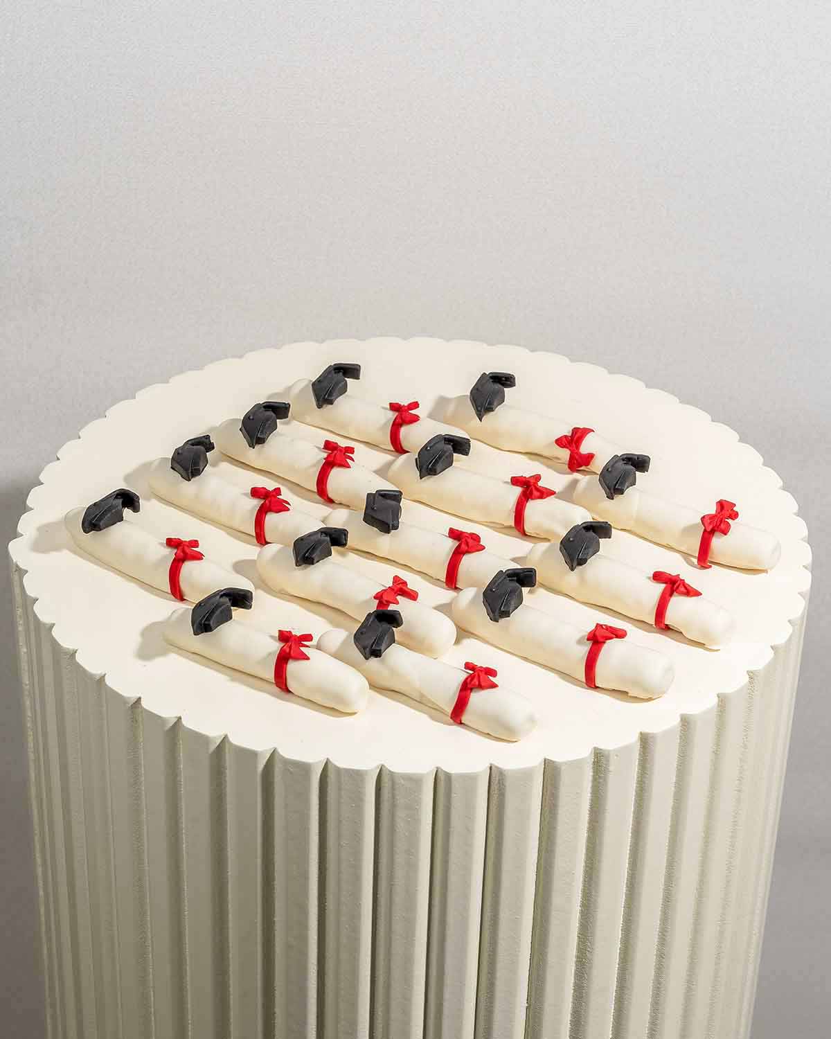 Graduation Theme Chocolate CigarsChocolate & ConfectioneryYour Gift Contains:• 13 x White chocolate covered edible cigars in Graduation theme• Chocolate Weight: 300g• Chocolate Size: 9x1x1.5cm• Box Size: 28x12x4cmHandling and Storage • Keep away from dire