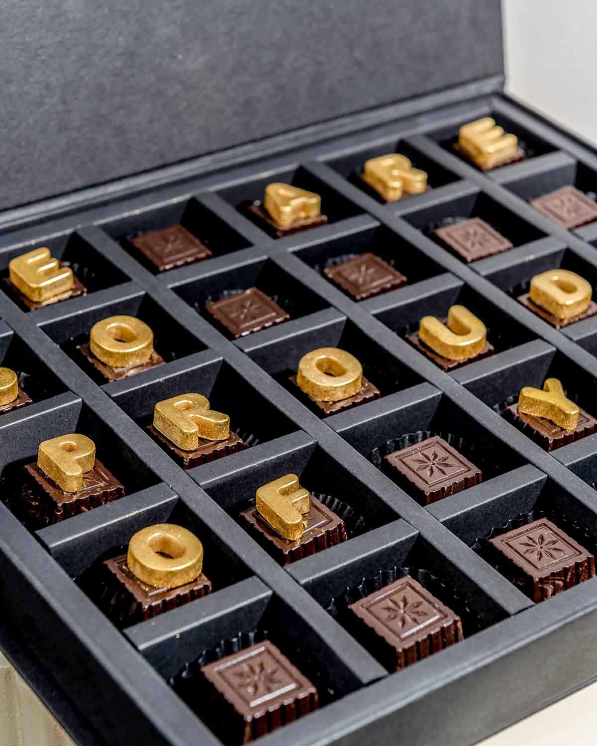 Graduation theme ChocolatesChocolate & ConfectioneryYour Gift Contains:• 30 Dark chocolates with customizable message• Flavors: Pistachio, Hazelnut, Speculoos, Peanut Butter and Roche (more flavors available on request)• Weight of chocolate: 500gms approx