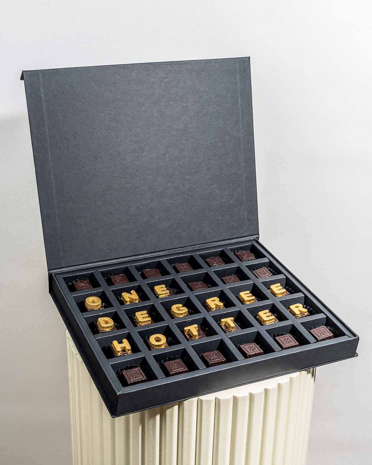 Graduation theme Customizable ChocolatesChocolate & ConfectioneryYour Gift Contains:• 30 Dark chocolates with customizable message• Flavors: Pistachio, Hazelnut, Speculoos, Peanut Butter and Roche (more flavors available on request)• Weight of chocolate: