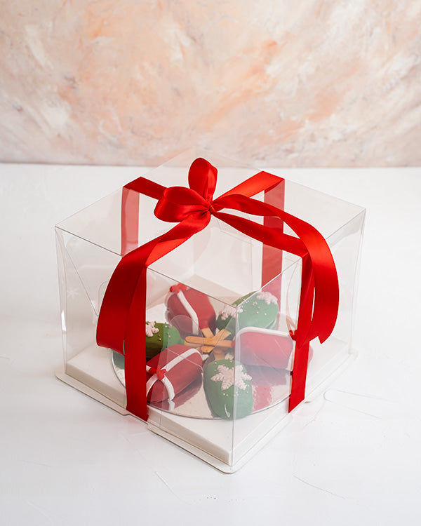 Christmas CakesiclesChocolate & ConfectioneryYour Gift Contains: • 6 pieces Christmas theme Red Velvet and Chocolate flavor cakesicles • Box Size: 18x18x23.5cm Handling and Storage • Keep away from direct heat and sunlight • Best stored between 12-18 °C •