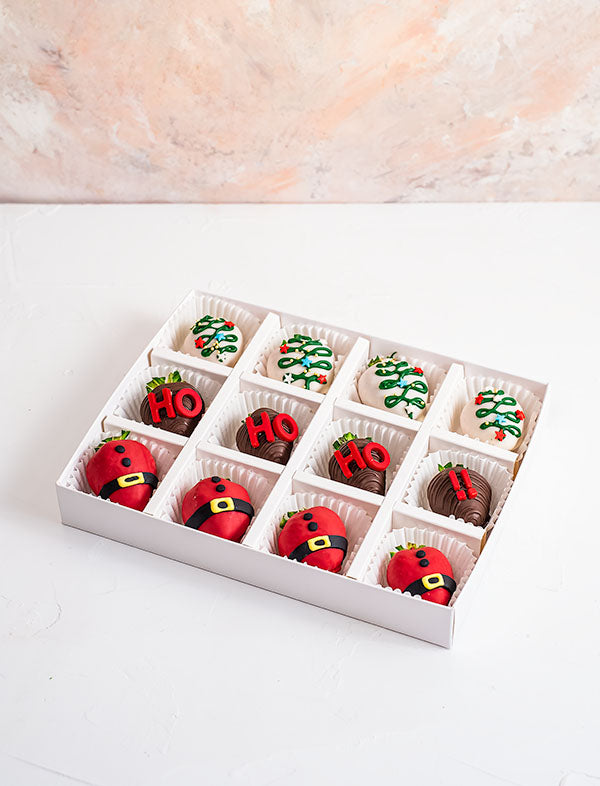 HO HO HO Chocolate Covered StrawberriesChocolate & ConfectioneryYour Gift Contains: • 12 pieces chocolate covered strawberries in holiday theme • Flavor: Milk, White and Colored Chocolate Handling and Storage • Keep away from direct heat and sunlight • Be