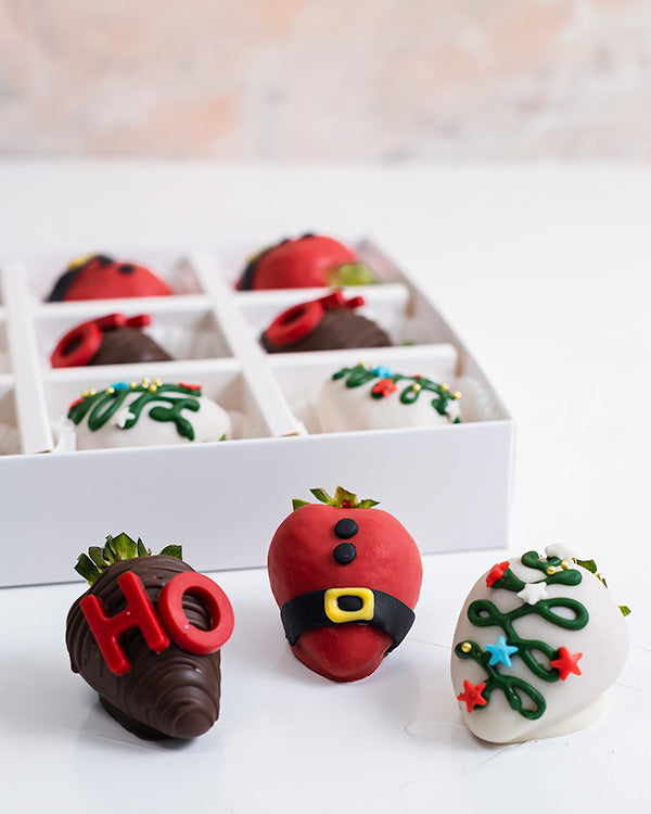HO HO HO Chocolate Covered StrawberriesChocolate & ConfectioneryYour Gift Contains: • 12 pieces chocolate covered strawberries in holiday theme • Flavor: Milk, White and Colored Chocolate Handling and Storage • Keep away from direct heat and sunlight • Be