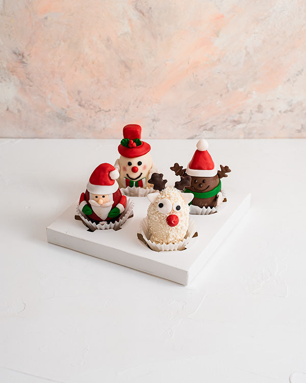 Edible Christmas Characters by NJDChocolate & ConfectioneryYour Gift Contains: • Christmas characters made with assorted Milk and White chocolate • 4 pieces - 125 grams each • Flavor: Hazelnut, Peanut Butter, Roche and Kinder • Weight of Chocolate: 500gra