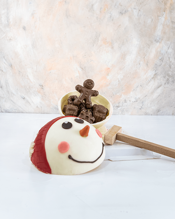 Winter is here by NJDChocolate & ConfectioneryYour Gift Contains: • Smash ball with 8 chunky Christmas theme assorted chocolates • Flavors: Pistachio, Sepculoos, Hazelnut, Praline, Peanut Butter • Hammer: 1 • Size of Chocolate: 12x12x14cm • Box Size: 20x2