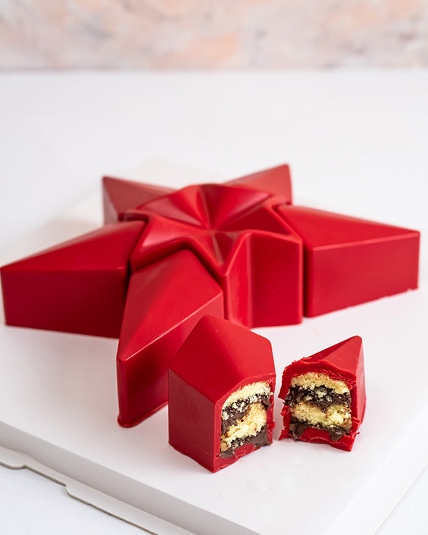 Star Shaped cake by NJDChocolate & ConfectioneryYour Gift Contains: • 900 gram Vanilla sponge cake with Milk Chocolate ganache filling covered with chocolate • Cake Size: 7.5x4.8x5.5cm, Ø9.6cm Handling and Storage • Keep away from direct heat and sunlight