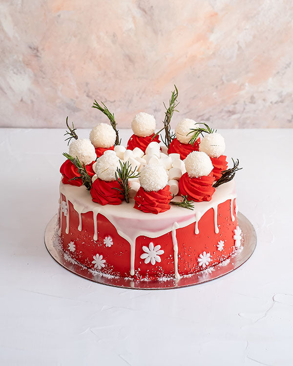 1kg Christmas CakeChocolate & ConfectioneryYour Gift Contains: • 1500 grams Vanilla cake with cream filling • Cake Sponge: Vanilla/Chocolate • Filling: Cream/Milk chocolate ganache • 8 White chocolate truffles • Weight of cake: 1500grams Handling and Stor