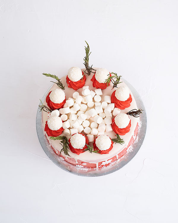 1kg Christmas CakeChocolate & ConfectioneryYour Gift Contains: • 1500 grams Vanilla cake with cream filling • Cake Sponge: Vanilla/Chocolate • Filling: Cream/Milk chocolate ganache • 8 White chocolate truffles • Weight of cake: 1500grams Handling and Stor