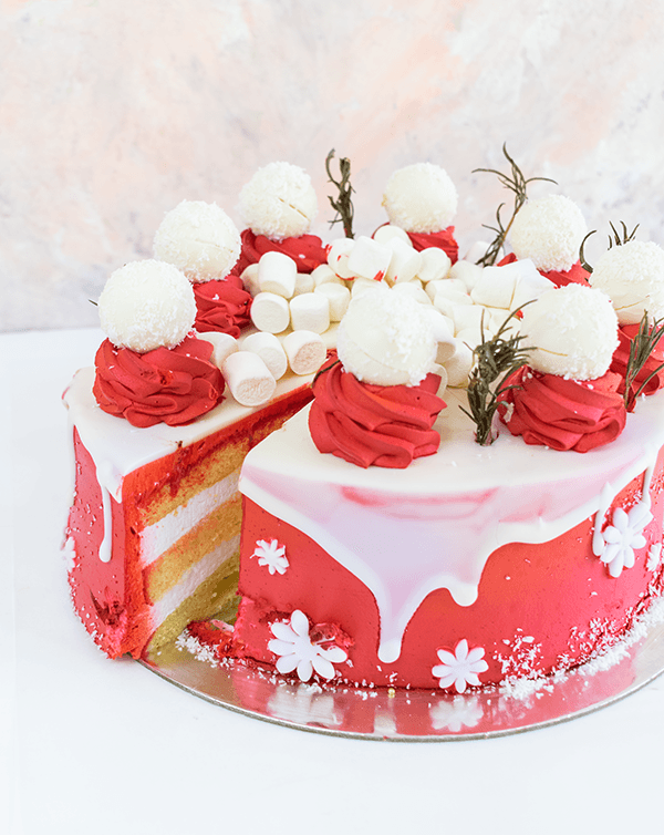 1kg Christmas CakeChocolate & ConfectioneryYour Gift Contains: • 1500 grams Vanilla cake with cream filling • Cake Sponge: Vanilla/Chocolate • Filling: Cream/Milk chocolate ganache • 8 White chocolate truffles • Weight of cake: 1500grams Handling and Stor