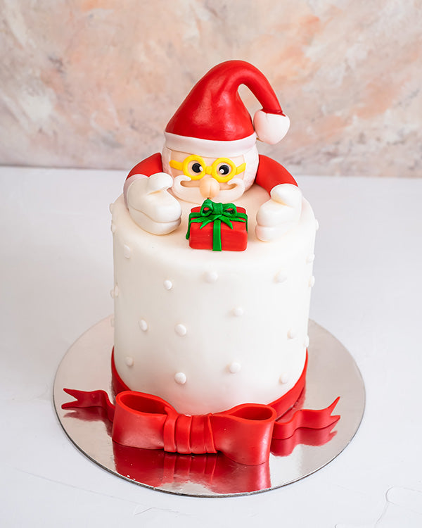 Santa Cake by NJDChocolate & ConfectioneryYour Gift Contains: • 2kg Vanilla/Chocolate Sponge Cake • Filling: Vanilla cream/Milk Chocolate Ganache Handling and Storage • Keep away from direct heat and sunlight • Best stored between 12-18 °C • NOT Suitable
