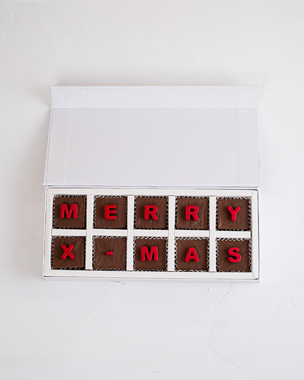 10pcs Merry Xmas boxChocolate & ConfectioneryYour Gift Contains: • 10 assorted milk chocolate with Merry Xmas message • Weight of Chocolate: 160grams approx. • Box Size: 29x12x4cm Handling and Storage • Keep away from direct heat and sunlight • Best store